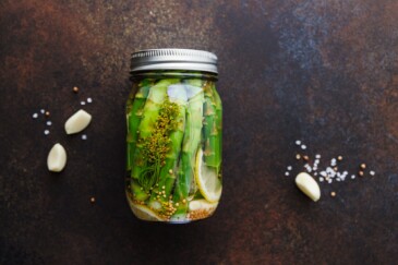 Top view of pickled asparagus in a jar